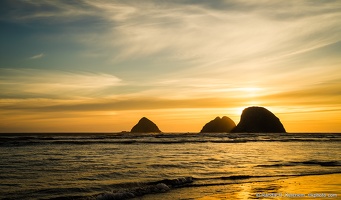 Sea Stacks at Oceanside, Setting Sun, Wispy Clouds