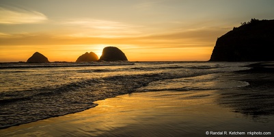 Sea Stacks at Oceanside, Setting Sun, Wispy Clouds, Golden Sand
